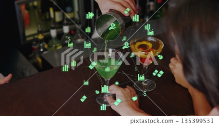 Shaking bartender pouring cocktail from shaker into martini glass at bar, coupe and digital graphs 135399531