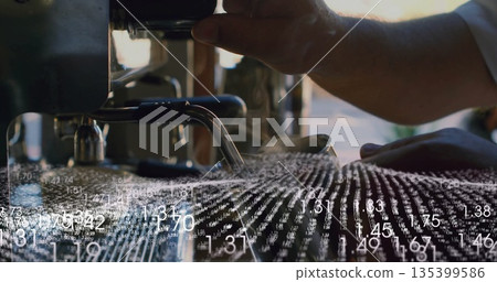 Inserting portafilter, barista aligning under espresso head at coffee bar, with digital overlay 135399586