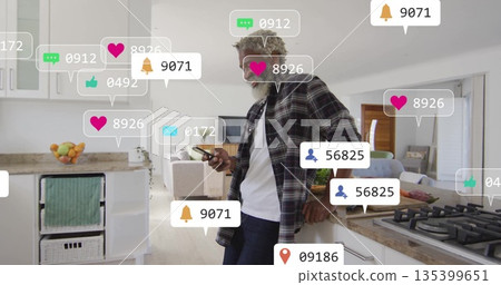 Checking smartphone notification icons, African American man leaning on kitchen island, copy space 135399651