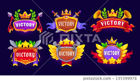 Victory award game icon badges asset. Game winner prize and trophy, level complete medal and victory award vector UI icons set of cartoon shield badges with gold stars, wings, crowns and ribbon banner 135399978