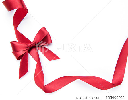 Red ribbon bow forming gift border on white Red ribbon bow forming gift border on white 135400021
