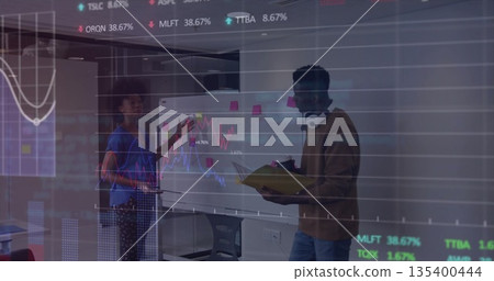 Colleagues collaborating on financial data in office meeting, with whiteboard and stock charts 135400444