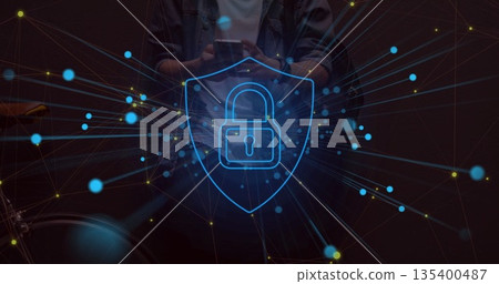 Man holding smartphone behind network overlay in room, padlock shield glowing and handlebar visible Man holding smartphone behind network overlay in room, padlock shield glowing and handlebar visible 135400487