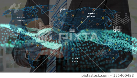 Businessman in suit holding touchscreen and viewing holographic map in office, with streaming data Businessman in suit holding touchscreen and viewing holographic map in office, with streaming data 135400488