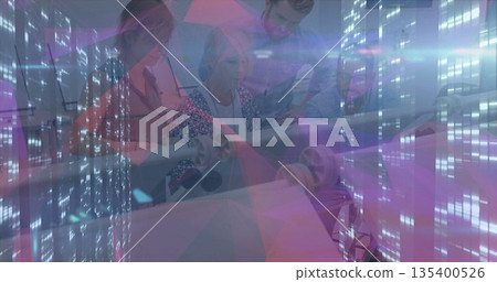 Collaborating team reviewing blueprint in modern office meeting room, with purple digital overlay Collaborating team reviewing blueprint in modern office meeting room, with purple digital overlay 135400526