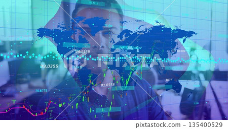 Clutching man in business shirt holding head in open-plan office, with floating map and charts 135400529