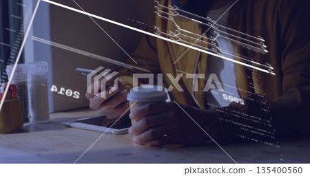 Man's hands holding smartphone and coffee cup, tapping tablet at cafe table with digital overlays Man's hands holding smartphone and coffee cup, tapping tablet at cafe table with digital overlays 135400560
