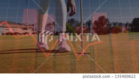 Mature female golfer positioning putter behind golf ball in putting green, with data overlay Mature female golfer positioning putter behind golf ball in putting green, with data overlay 135400622