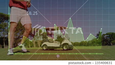 Golfer in golf attire holding smartphone beside golf cart on fairway, showing overlay, copy space 135400631