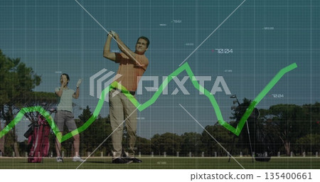 Swinging male golfer in orange polo hitting ball on fairway, with grid overlay and trend line 135400661