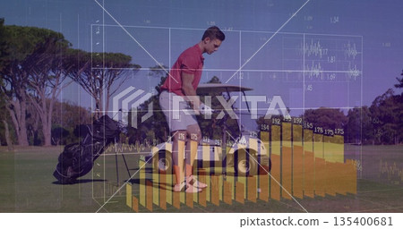 Bending golfer wearing red polo placing golf ball on tee at tee box, with performance data 135400681
