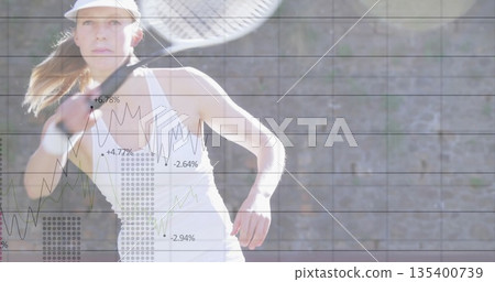 Tennis player swinging racket wearing athletic tank top and visor on court, with digital overlay 135400739