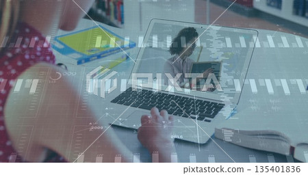 Studying teenage girl working on silver laptop with teacher at home with notebooks and data charts Studying teenage girl working on silver laptop with teacher at home with notebooks and data charts 135401836