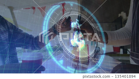 Clinking friends raising amber beer bottles over kitchen bar, with red cup, streamers, hologram 135401894