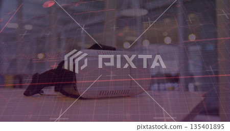 Resting virtual reality headset displaying red grid overlay on showroom table, futuristic theme Resting virtual reality headset displaying red grid overlay on showroom table, futuristic theme 135401895