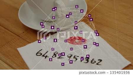 Teacup resting on saucer on cafe table, showing kissed napkin with phone number and social icons Teacup resting on saucer on cafe table, showing kissed napkin with phone number and social icons 135401936