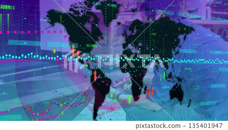 Displaying world map overlay with candlestick and trend data points in office lounge with tablet 135401947
