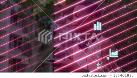 Holding smartphone, woman wearing headphones on city sidewalk, with fintech icons and neon streaks 135401953