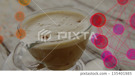 Displaying clear glass coffee cup resting on wooden tabletop, with network graphic nodes Displaying clear glass coffee cup resting on wooden tabletop, with network graphic nodes 135401985
