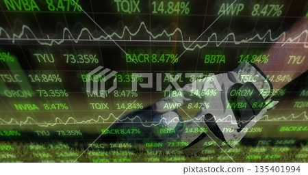 Stepping soccer cleat with shin guard on sports field turf, with stock ticker overlay, copy space 135401994