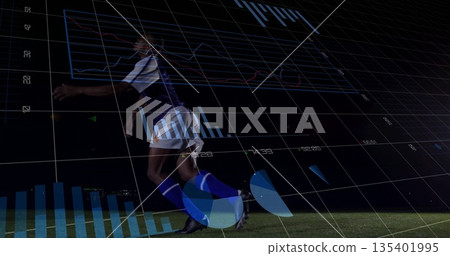 Sprinting soccer player in purple jersey and shorts on grass pitch at night, with digital overlays 135401995