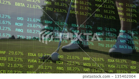 Putting golfer in white shoes striking golf ball with putter on putting green, with ticker overlays 135402004