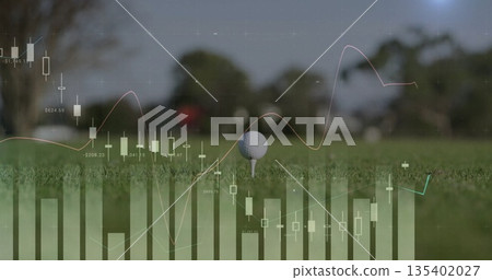 Highlighting golf ball resting on tee amid manicured grass on fairway, with financial chart overlay 135402027