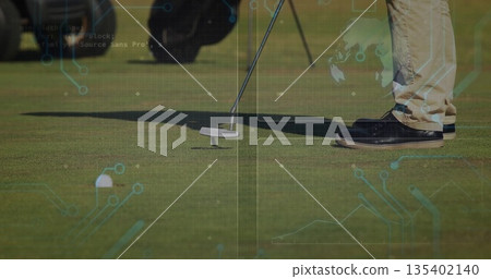 Putting golfer in golf pants moving putter over putting green, with white golf ball, blurred gear Putting golfer in golf pants moving putter over putting green, with white golf ball, blurred gear 135402140