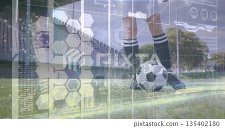 Balancing female soccer player wearing kit, foot on soccer ball at sideline, hex overlay 135402180