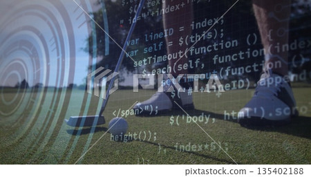 Positioning golfer's lower legs over golf ball on putting green, with putter head and code overlay 135402188