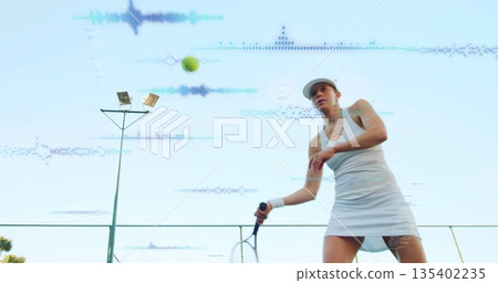 Tennis player swinging racket in sportswear at court, with tennis ball, chainlink fence, copy space Tennis player swinging racket in sportswear at court, with tennis ball, chainlink fence, copy space 135402235