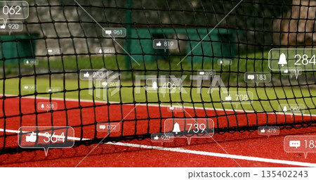 Displaying tennis net presenting floating social media icons on red court with grass background Displaying tennis net presenting floating social media icons on red court with grass background 135402243