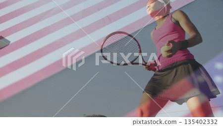 Tennis player in sportswear preparing to serve on court, with racket, ball and net, copy space 135402332