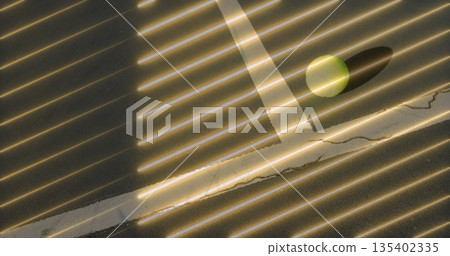 Sun casting stripes across cracked paint tabletop in room with yellow-green ball shadow, copy space Sun casting stripes across cracked paint tabletop in room with yellow-green ball shadow, copy space 135402335