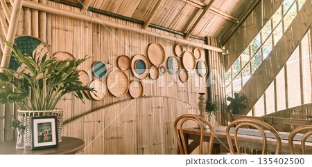 Bamboo room decorated with woven bamboo baskets on walls 135402500