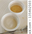 Small dipping bowl completely emptied after meal 135402503