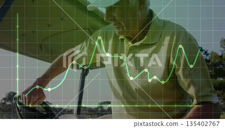 Steering senior in green polo white cap gripping controls on golf course, with grid, chart overlays Steering senior in green polo white cap gripping controls on golf course, with grid, chart overlays 135402767