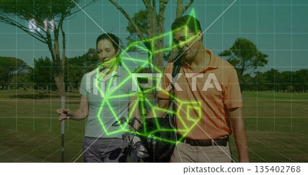 Mature couple golfers wearing polos walking fairway, carrying golf clubs and golf bag Mature couple golfers wearing polos walking fairway, carrying golf clubs and golf bag 135402768