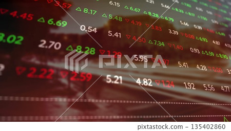 Displaying stock market numbers overlay filling blurred street backdrop, with green red triangles 135402860
