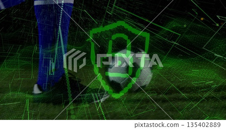 Balancing soccer player's leg in black cleat on soccer ball on turf, digital grid, green shield Balancing soccer player's leg in black cleat on soccer ball on turf, digital grid, green shield 135402889