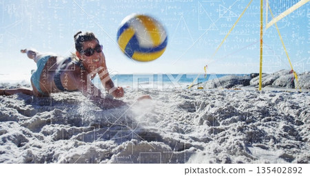 Diving player in swimwear reaching volleyball at sandy beach, with net and sunglasses, copy space 135402892