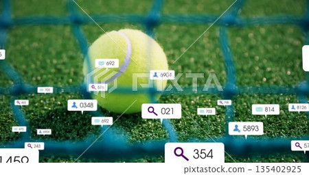 Yellow tennis ball pressing against blue tennis net on green court, with floating UI icons 135402925