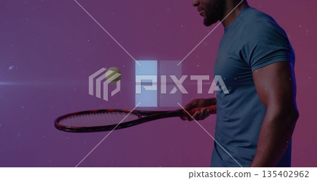 Balancing tennis ball on racket, man wearing tee in studio, with four-square logo copy space 135402962
