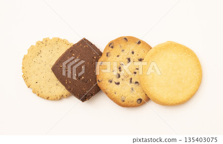 Cookies lined up on a white background Cookies lined up on a white background 135403075