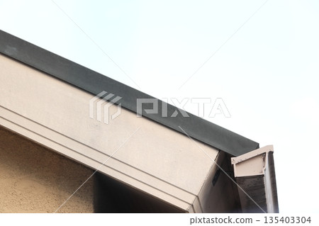 Photo of part of the roof of a private house Photo of part of the roof of a private house 135403304