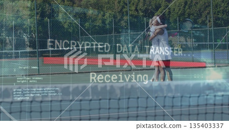 Hugging tennis teammates on court behind net, holding rackets and showing code overlay, copy space Hugging tennis teammates on court behind net, holding rackets and showing code overlay, copy space 135403337