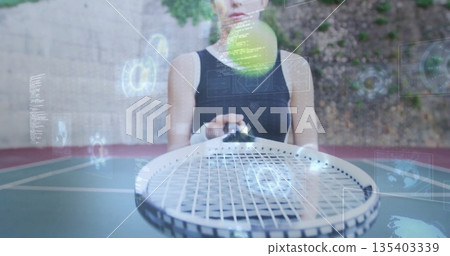 Balancing athlete in black sports top holding racket on tennis court with ball and digital overlays Balancing athlete in black sports top holding racket on tennis court with ball and digital overlays 135403339