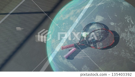 Showing tennis rackets with pink grips crossing globe over tennis ball on court, with code floating 135403392
