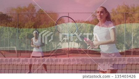 Pink skirt player returning ball on clay court with rackets, net and chain-link fence, copy space Pink skirt player returning ball on clay court with rackets, net and chain-link fence, copy space 135403426