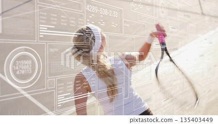 Tennis player with headband hitting forehand shot at practice wall, with racket and data overlays Tennis player with headband hitting forehand shot at practice wall, with racket and data overlays 135403449